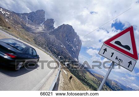 Car moving besides signboard on countryroad, Dolomites, Italy View Large Photo Image Stock Image - Car moving besides signboard on countryroad, Dolomites, Italy . Fotosearch