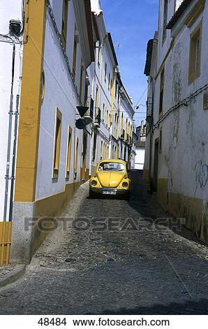 Picture - Car passing through street, Evora, Alentejo, Portugal . Fotosearch