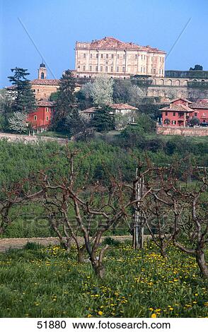 Stock Image - Castle on hill against blue sky, Guarene, Provinz Cuneo, Piedmont, Italy . Fotosearch