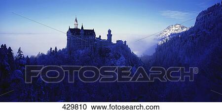 Stock Image - Castle on hill, Neuschwanstein Castle, Ostallgaeu, Germany . Fotosearch