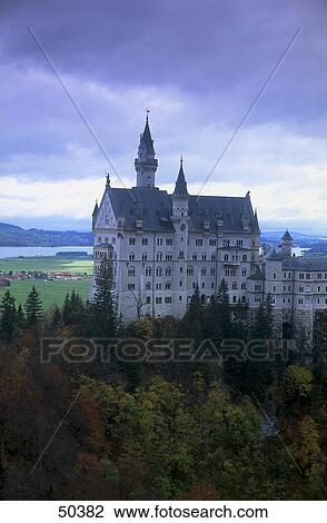Castle on landscape against cloudy sky, Neuschwanstein Castle, Bavaria, Germany View Large Photo Image Stock Image - Castle on landscape against cloudy sky, Neuschwanstein Castle, Bavaria, Germany . Fotosearch