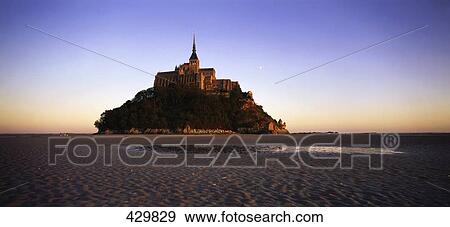 Stock Photo - Cathedral on island at dusk, Mont Saint-Michel, Normandy, France . Fotosearch