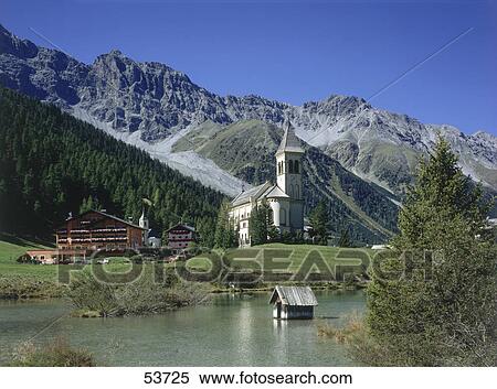 Stock Photography - Church at lakeside, Sulden, Vinschgau, Alto Adige, Italy . Fotosearch