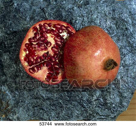 Picture - Close-up of a cut pomegranate . Fotosearch