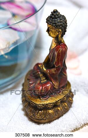 Stock Photo - Close-up of an idol of the Buddha . Fotosearch