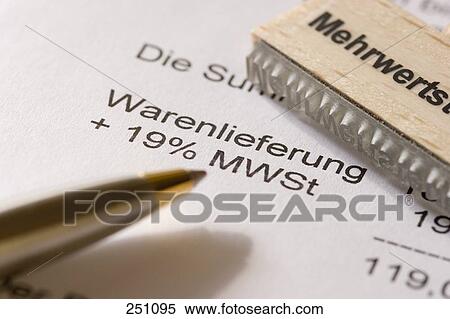 Stock Photography - Close-up of ballpoint pen and rubber stamp on bill . Fotosearch