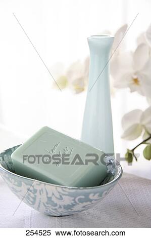 Stock Photography - Close-up of bar of soap in bowl . Fotosearch