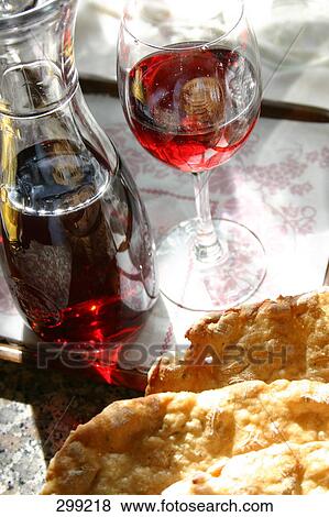 Close-up of bottle and glass of red wine View Large Photo Image Stock Photo - Close-up of bottle and glass of red wine . Fotosearch
