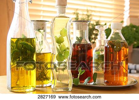 Close-up of bottles of cooking oil View Large Photo Image Stock Photo - Close-up of bottles of cooking oil . Fotosearch