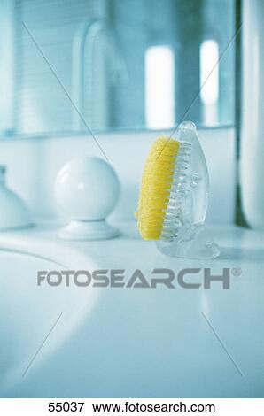 Stock Photo - Close-up of brush at washbasin . Fotosearch