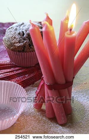 Close-up of bundle of lit candles View Large Photo Image Stock Image - Close-up of bundle of lit candles . Fotosearch