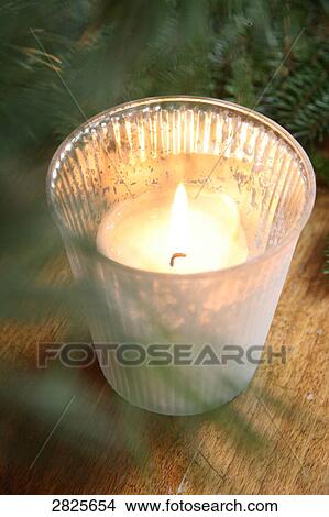 Close-up of burning candle in cup View Large Photo Image Picture - Close-up of burning candle in cup . Fotosearch