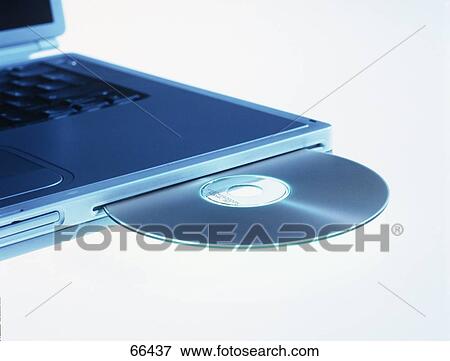 Stock Photo - Close-up of CD and laptop . Fotosearch