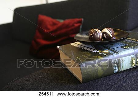 Stock Image - Close-up of chocolate balls on plate . Fotosearch
