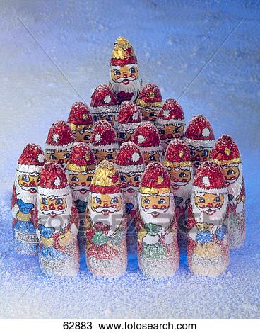 Close-up of chocolate Santa clauses in snow View Large Photo Image Stock Image - Close-up of chocolate Santa clauses in snow . Fotosearch