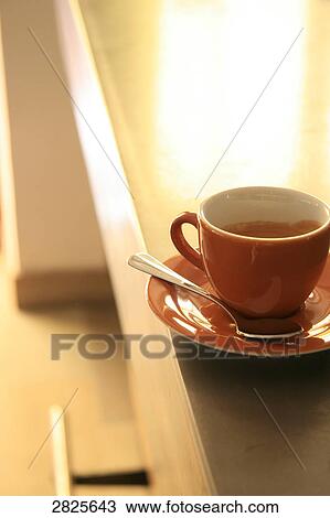 Close-up of coffee cup and spoon on saucer View Large Photo Image Stock Image - Close-up of coffee cup and spoon on saucer . Fotosearch
