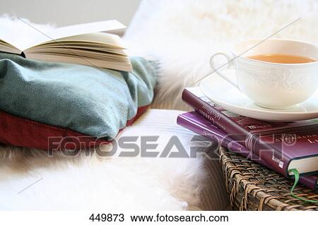 Close-up of cup of black tea on book View Large Photo Image Stock Image - Close-up of cup of black tea on book . Fotosearch