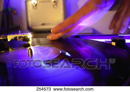Close-up of DJ's hand on turntable View Large Photo Image Stock Image - Close-up of DJ's hand on turntable . Fotosearch