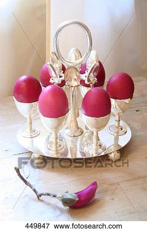 Close-up of Easter eggs in egg cups View Large Photo Image Stock Photo - Close-up of Easter eggs in egg cups . Fotosearch