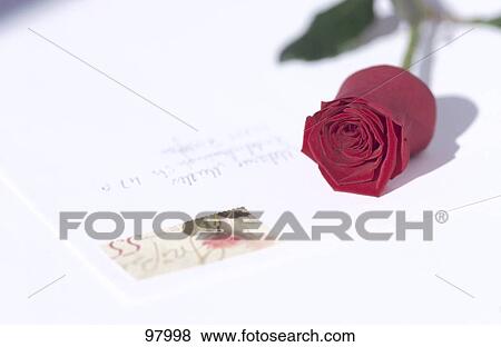 Stock Photo - Close-up of love letter and rose . Fotosearch