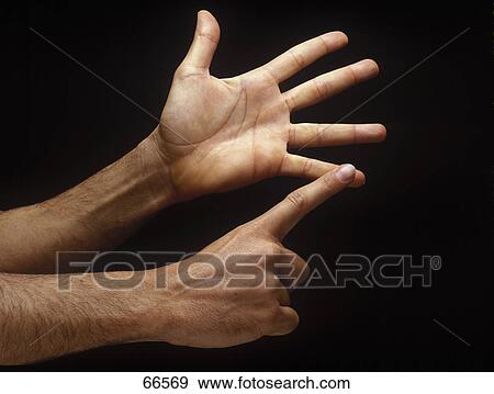 Stock Photo - Close-up of man counting on his fingers . Fotosearch