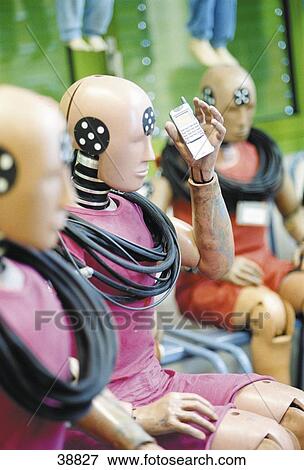 Close-up of mannequin holding mobile phone View Large Photo Image Stock Photo - Close-up of mannequin holding mobile phone . Fotosearch