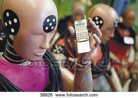 Close-up of mannequin holding mobile phone View Large Photo Image Stock Photograph - Close-up of mannequin holding mobile phone . Fotosearch
