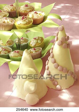 Stock Image - Close-up of pastries on plates . Fotosearch