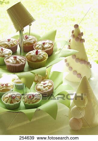 Stock Photo - Close-up of pastries on plates . Fotosearch