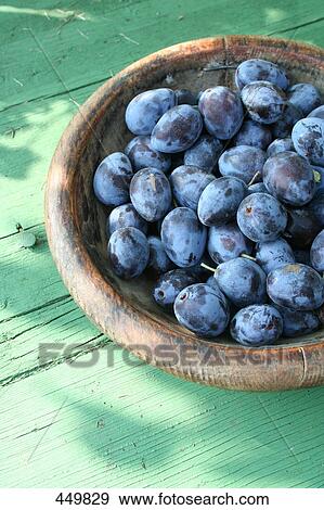 Close-up of plums in wooden bowl View Large Photo Image Stock Photo - Close-up of plums in wooden bowl . Fotosearch