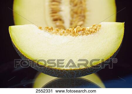 Close-up of slice of cantaloupe View Large Photo Image Stock Image - Close-up of slice of cantaloupe . Fotosearch