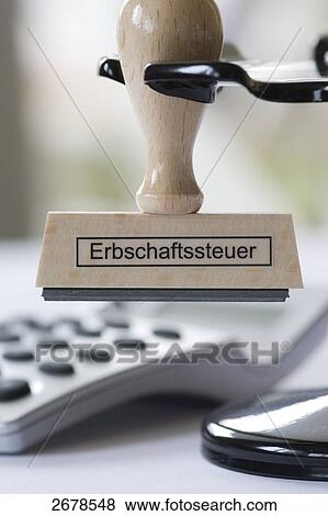 Stock Photo - Close-up of stamp and pocket calculator . Fotosearch