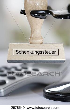 Stock Photo - Close-up of stamp and pocket calculator . Fotosearch