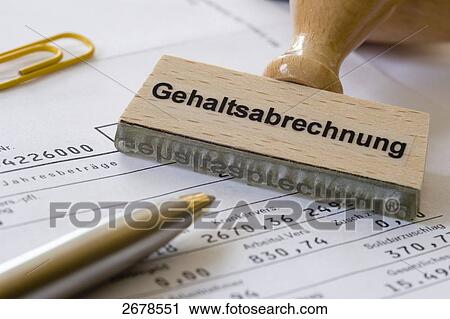 Stock Image - Close-up of stamp with paperclip and pen on payslip . Fotosearch