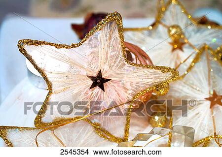 Close-up of star shaped Christmas decorations View Large Photo Image Picture - Close-up of star shaped Christmas decorations . Fotosearch