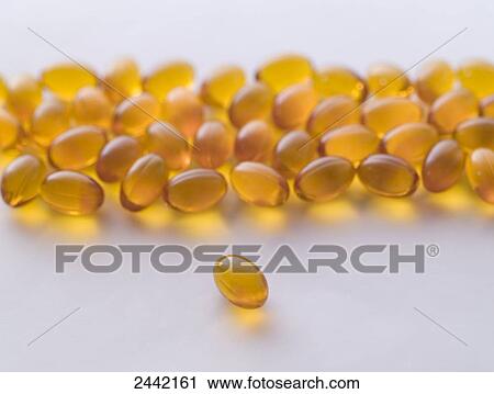 Stock Image - Close-up of vitamin pills . Fotosearch