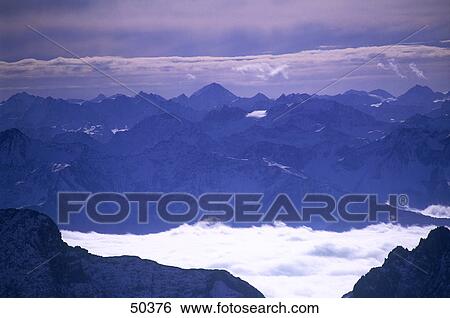 Clouds around mountains, Wetterstein Mountains, Bavaria, Germany View Large Photo Image Stock Photograph - Clouds around mountains, Wetterstein Mountains, Bavaria, Germany . Fotosearch