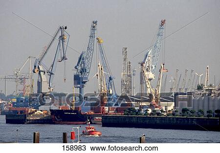 Cranes and container ship at port, Elbe River, Hamburg, Germany View Large Photo Image Stock Image - Cranes and container ship at port, Elbe River, Hamburg, Germany . Fotosearch