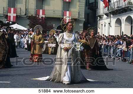 Picture - Crowd looking at people in costumes during festival, Asti, Piedmont, Italy . Fotosearch