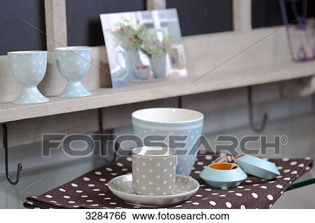 Stock Photograph - Cups on a shelf . Fotosearch