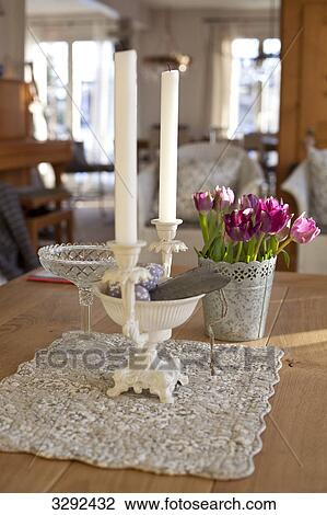 Stock Image - Decorated table in a living room . Fotosearch