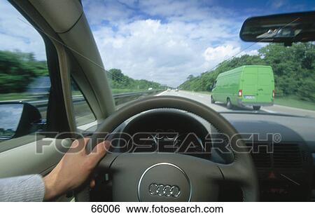 Driver driving car on highway View Large Photo Image Stock Photograph - Driver driving car on highway . Fotosearch