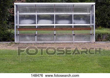 Stock Photograph - Empty bench in soccer ground . Fotosearch