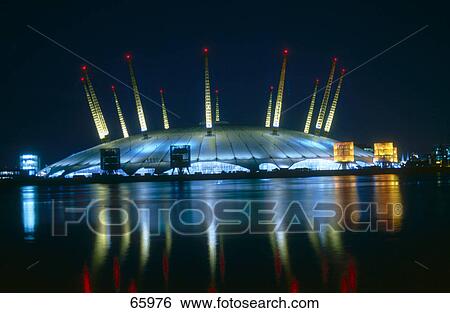 Exhibition house lit up at night, The O2, London, England View Large Photo Image Stock Photograph - Exhibition house lit up at night, The O2, London, England . Fotosearch