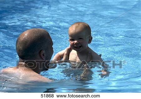 Father and baby in swimming pool View Large Photo Image Stock Photo - Father and baby in swimming pool . Fotosearch