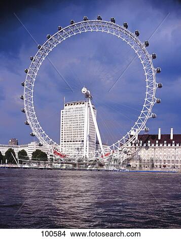 Ferris wheel on riverbank, Thames River, England View Large Photo Image Picture - Ferris wheel on riverbank, Thames River, England . Fotosearch