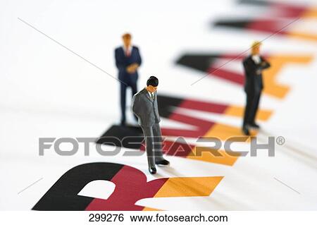 Figurines of businessmen standing on German flag View Large Photo Image Stock Photograph - Figurines of businessmen standing on German flag . Fotosearch