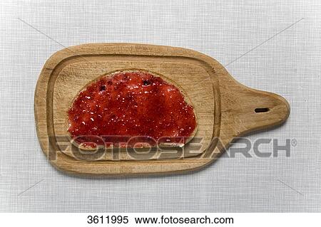 Stock Photography - Fly on slice of bread with jam . Fotosearch