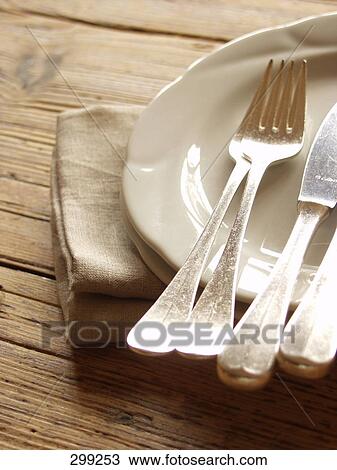 Forks and table knives on plate View Large Photo Image Stock Image - Forks and table knives on plate . Fotosearch