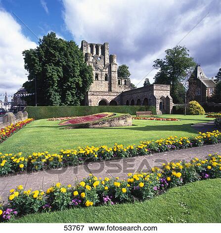 Stock Photo - Formal garden in front of monastery, Kelso Abbey, Scotland . Fotosearch